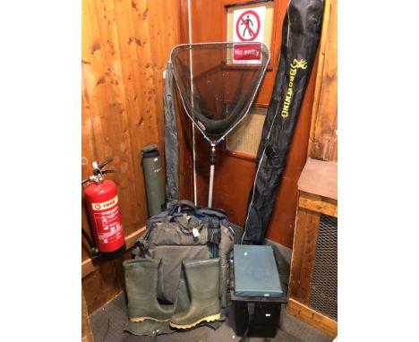 A collection of fishing equipment to include a Shakespeare Sigma GL carbon kevlar fishing pole, Shakespeare SKP 5.0m fishing 