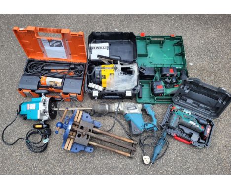 A collection of power tools to include a boxed DeWalt DW625E 240v 200w router, a boxed Bosch PSB240 24V battery drill with ch