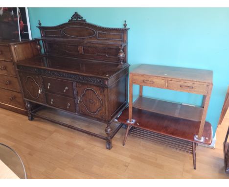 An Edwardian buffet sideboard, having raised gallery back with dentil carving and central shell motif, fitted with two centra