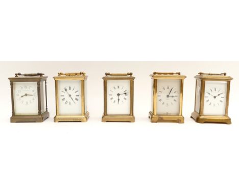 Five mid to late 20th century brass carriage clocks, housing eight day movements, to include, a JE Caldwell example, H-11cm, 