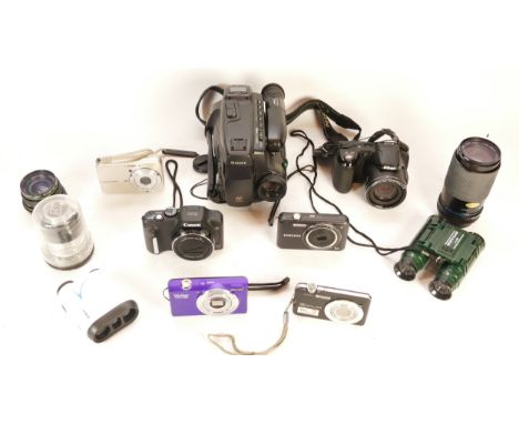 A collection of cameras and camera accessories, to include, Vivitar Vivicam S830, Casio EX-S10, and a Carl Zeiss Jena f/4.5-5