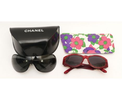 Two pairs of ladies designer sunglasses, to include a cased pair of Chanel and a pair of Versace sunglasses. (2)