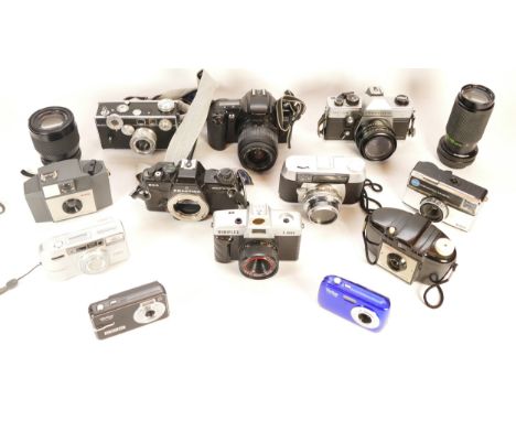 A collection of cameras and camera accessories, to include, a Praktica MTL5B, a Canon EOS 3000, and a Prakticar f/4-5.6 70-21