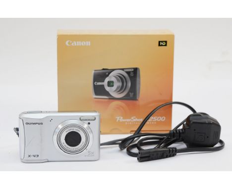 An Olympus X-43 digital camera, with a unrelated Canon Powershot A2500 box (no camera included)&nbsp;