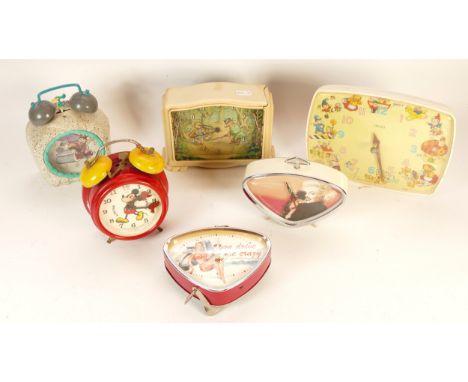 A selection of novelty clocks, to include, a 1950s Smiths example depicting Noddy and a 1987 Avronel and Walt Disney Company 