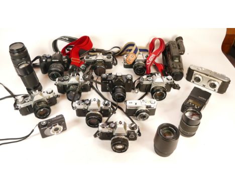 A collection of cameras and camera accessories, to include, Nikon Coolpix L810, Canon AE-1, and Canon EF f/4-5.6 75-300mm. (1
