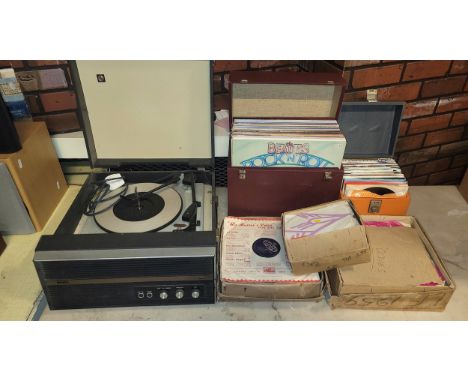 A 1960s Bush portable record player, together with a selection over sixty 33/45 rpm vinyl records, primarily 'Pop' from the 1