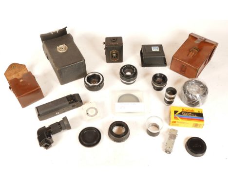 A collection of cameras and camera accessories, to include, an Olympus Zuiko f/1.8 50mm lens, a Zeiss Ikon baby box, and a Je