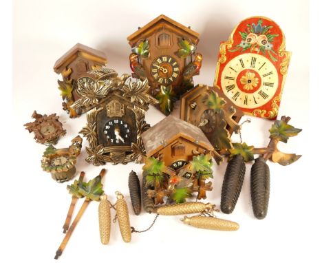 A collection of six mid-twentieth century Black Forest cuckoo clocks, having single and twin train manual wind movement, suit