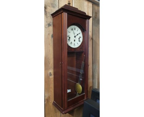 A modern mahogany cased wall clock, having eight day movement, with pendulum and key.