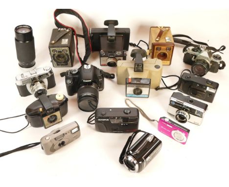 A collection of cameras and camera accessories, to include, a Pentax ME Super, a Polaroid Swinger II Land Camera, and a Hoya 