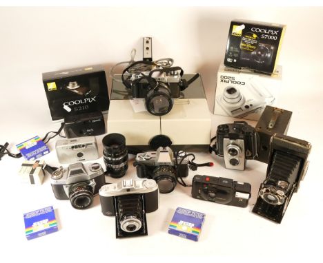 A selection of cameras, lenses and equipment, to include Nikon digital Coolpix S210, 5200, S7000, two Minolta 35mm X-300, vin