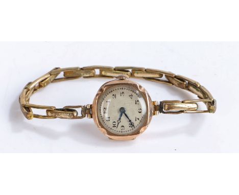 9 carat gold ladies wristwatch, the engine turned effect dial with Arabic numerals, manual wound, the case 21mm wide, on a gi