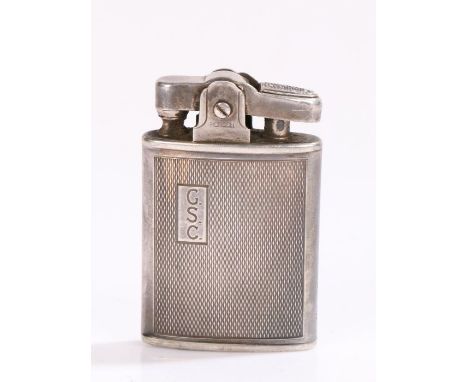 Ronson silver cigarette lighter, the engine turned body with rectangular cartouche initialled GSC