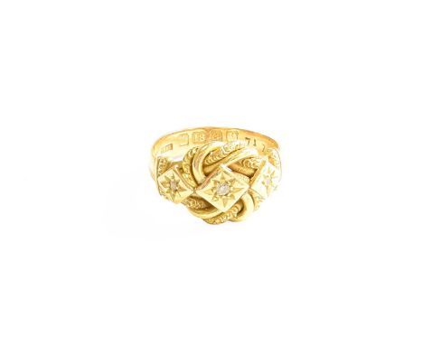 An 18 Carat Gold Diamond Three Stone Ring, the old cut and rose cut diamonds in yellow square settings, conjoined by a scroll