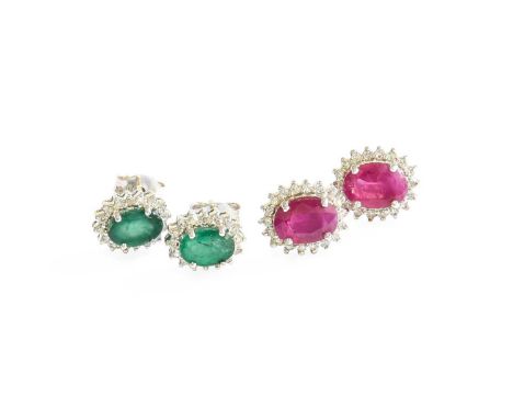 A Pair of Emerald and Diamond Cluster Earrings, the oval cut emerald within a border of eight-cut diamonds, in white claw set