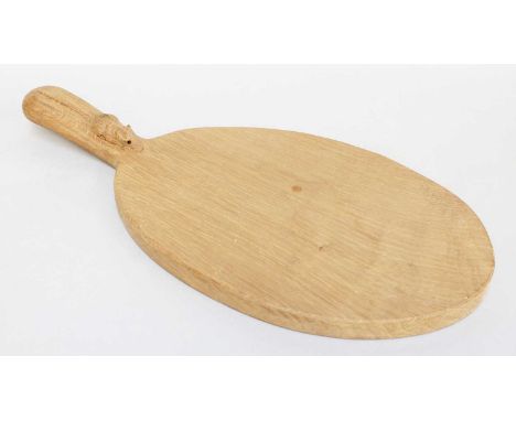 Workshop of Robert Mouseman Thompson (Kilburn): An English Oak Cheese Board, post 1960, of standard form, with carved mouse t