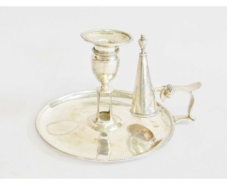 A George III Silver Chamber-Candlestick, by John Schofield, London, 1780, the base oval and with beaded border, with scroll h
