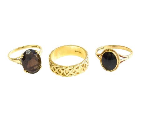 A 14 Carat Gold Band Ring, finger size P; A 9 Carat Gold Smoky Quartz Ring, finger size O; and A 9 Carat Gold Jet Ring, finge