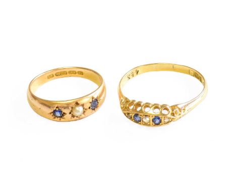 A 15 Carat Gold Sapphire and Split Pearl Ring, the split pearl flanked by round cut sapphires, in yellow star settings, finge