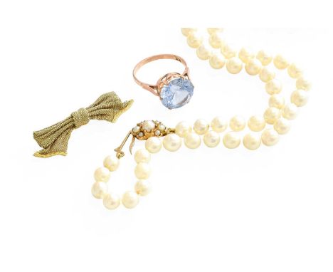 A Cultured Pearl Necklace, with a 9 carat gold split pearl clasp, length 47cm; A Bow Brooch, stamped '15CT', length 4.3cm; an