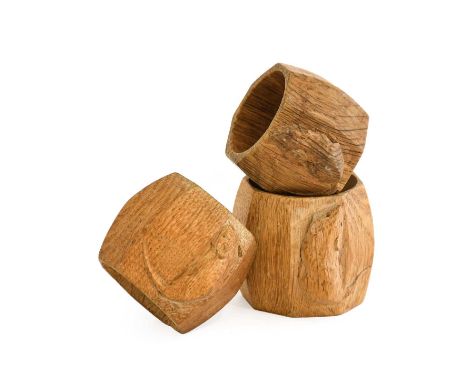 Workshop of Robert Mouseman Thompson (Kilburn): Three English Oak Napkin Rings, of standard octagonal form, each with carved 