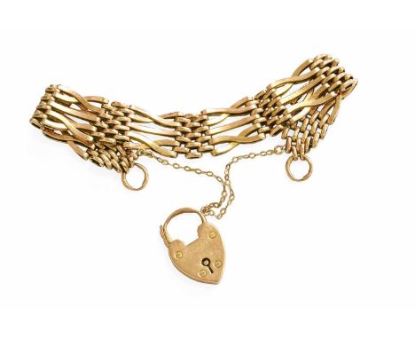 A Gate Link Bracelet, the padlock and end link stamped '9C', length 18.5cmGross weight 18.0 grams.