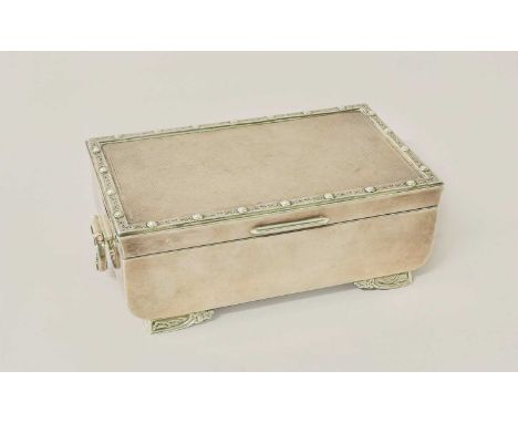 An Elizabeth II Silver Cigarette-Box, by Adie Brothers, Birmingham, 1962, oblong and on four panel feet, the feet and rim wit