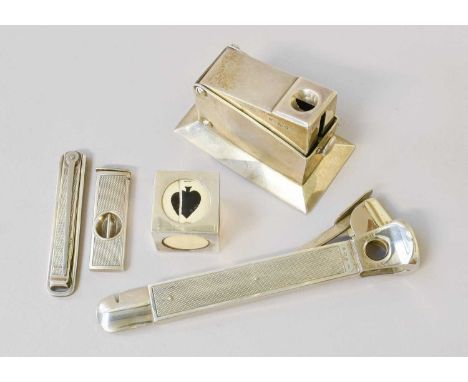 Three Silver Cigar-Cutters, two with engine-turned decoration; Together With a silver pipe multi-tool, retailed by Dunhill an