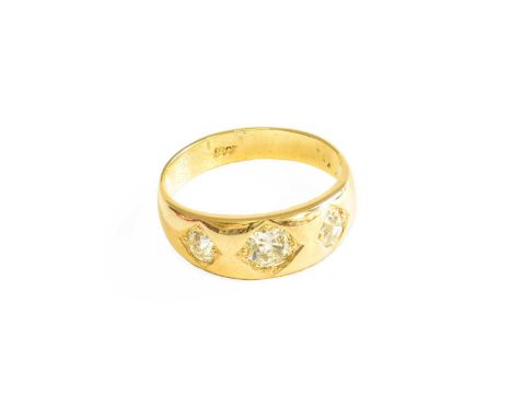 A Diamond Three Stone Ring, the graduated old cut diamonds, in yellow square settings, to a plain polished shank, finger size