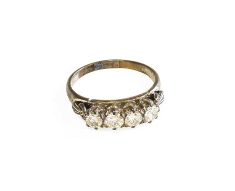 A Diamond Four Stone Ring, the round brilliant cut diamonds in white claw settings, to a plain polished shank, total estimate