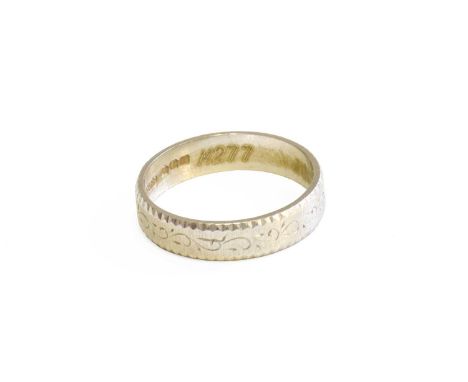 A Textured Platinum Band Ring, finger size QGross weight 5.8 grams.