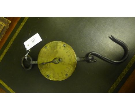 A Salters spring balance scale with circular brass dial and iron hooks, the dial marked Silvesters patent