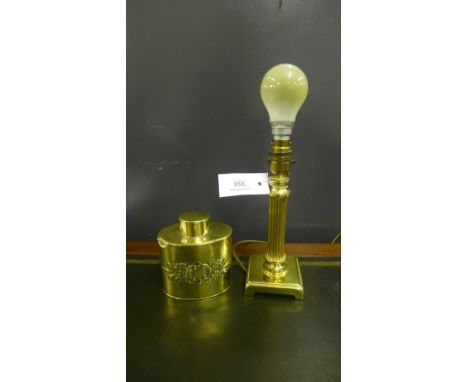 A brass floral embossed tea caddy together with a brass corinthian column table lamp (2) 