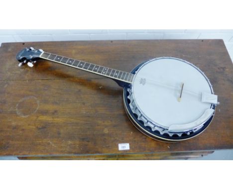 A Vintage rosewood cased Remo Weather King four-stringed Banjo with mother-of-pearl tuning pegs, length, 98cm 