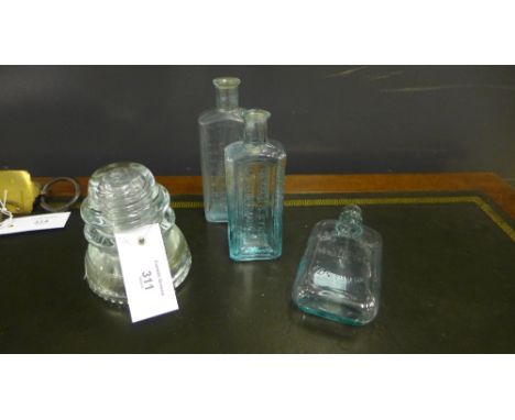 A Hemingray No.42 glass wire insulator together with three vintage glass bottles (4)