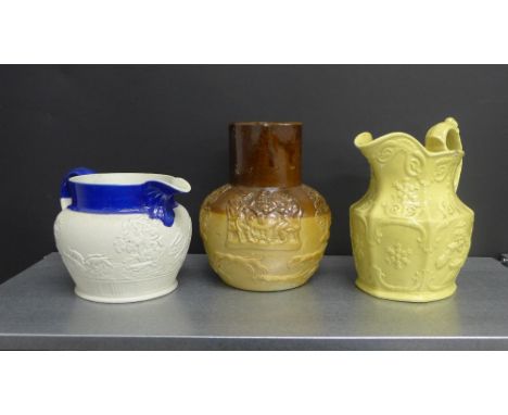 A collection of three Staffordshire jugs to include a salt glazed two-tone jug depicting hounds and stag, another blue rimmed