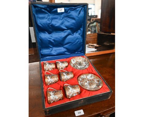 A late 19th century Japanese cased set of six eggshell porcelain cups and saucers, finely-painted and gilded with ladies and 