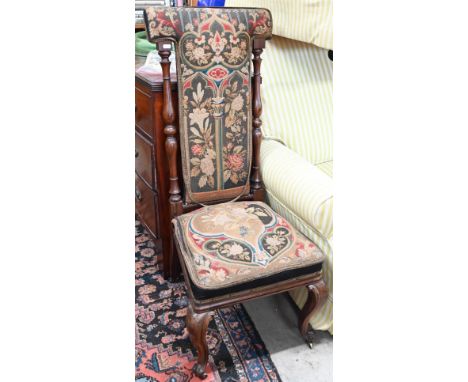 A Victorian rosewood tapestry upholstered pre-dieu 