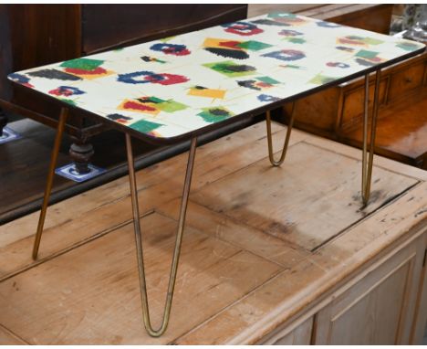 A 1960s Anoretti (Italian) design coffee table with abstract-design melamine top, on detachable sprung wire supports, 80 x 40