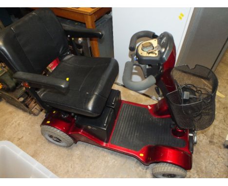 A STERLING MOBILITY SCOOTER PLUS CHARGER