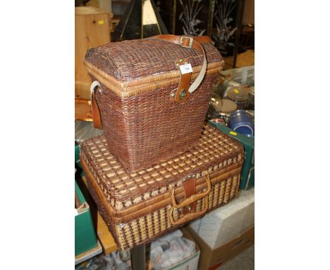 A WICKERWARE PICNIC HAMPER TOGETHER WITH ANOTHER