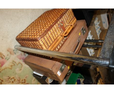 A VINTAGE LEATHER SUITCASE TOGETHER WITH A PICNIC HAMPER 