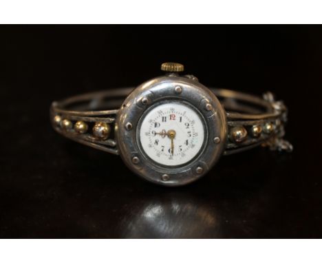 AN ANTIQUE SILVER BANGLE WRIST WATCH 
