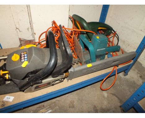 A RYOBI PETROL CHAINSAW TOGETHER WITH TWO ELECTRIC HEDGE TRIMMERS