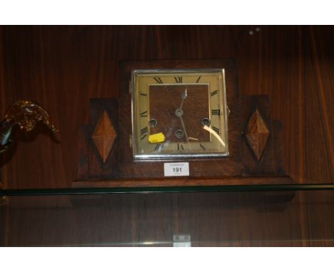 AN ART DECO OAK MANTLE CLOCK