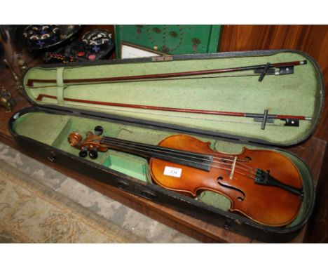 A CASED VINTAGE VIOLIN AND TWO BOWS WITH INNER LABEL READING ANTONIUS STRADIVARIUS GREMONENSIS FACIEBAT ANNO 1713 MADE IN CZE