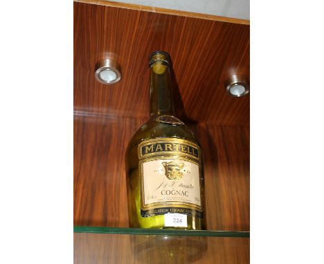 A LARGE EMPTY MARTELL COGNAC BOTTLE
