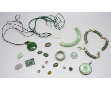A collection of green gemstones and other pieces including jade 