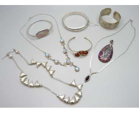 A collection of silver jewellery including bracelets and necklaces, 113g together with an Eastern metal bangle